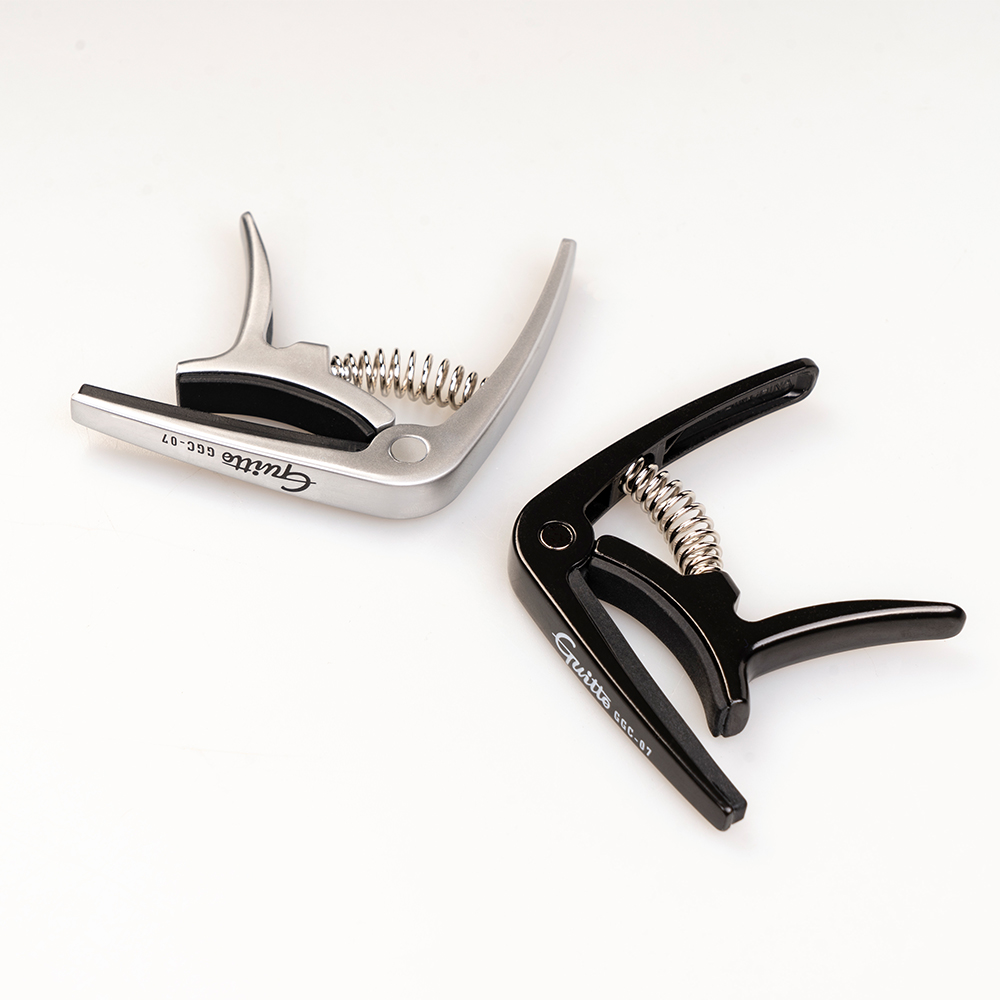 GUITTO GGC-07 Ukulele Capo Qui - đánh giá và giá Musical Instrument In English